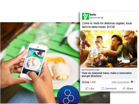 Two women with a dog and mobile device showing a Veterinarian's Facebook ad